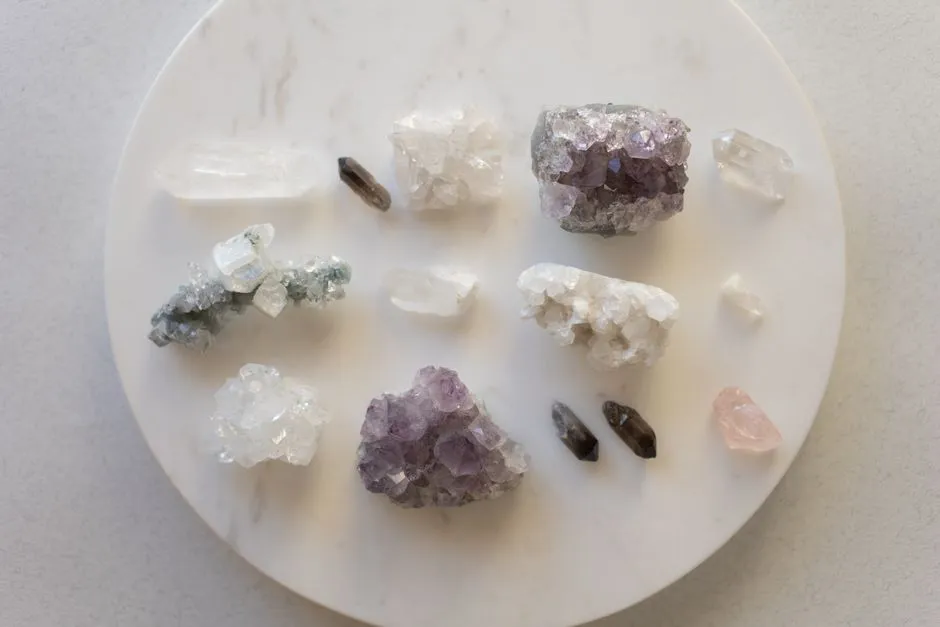 Flat-lay arrangement of assorted polished crystals and mineral chunks